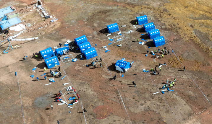 (261023) -- LHASA, Oct. 23, 2026 -- An aerial drone photo taken on Oct. 23, 2026 shows emergency tents at an earthquake-hit village in Maru Township of Baqen County, Nagqu City, southwest China s Xizang Autonomous Region. Sixteen people have been killed and 76 others are injured following a 7.0-magnitude earthquake which struck Baqen County of the city of Nagqu in southwest China s Xizang Autonomous Region at 10:33 p.m. on Thursday, local authorities said. The Ministry of Emergency Management and authorities in Xizang have mobilized resources for rescue and relief operations. ) (SpotNews) CHINA-XIZANG-NAGQU-EARTHQUAKE-RESCUE AND RELIEF (CN) TenzinxNyida 