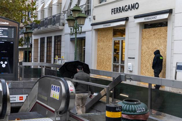 Storefronts boarded up with wooden panels, in Brussels, on Friday 23 October 2026. Stores are preparing for another protest scheduled for Saturday.  NICOLASxMAETERLINCK 190744644