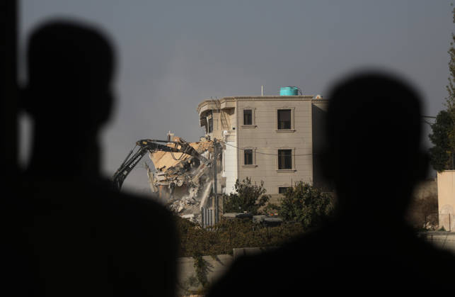 Israeli forces demolish a building in West Bank city of Hebron HEBRON, WEST BANK, PALESTINE - OCTOBER 23: Israeli military heavy machinery demolishes a building during a raid in the West Bank city of Hebron, Palestine, on October 23, 2026. The Israeli military announced earlier in the morning that two of its soldiers were killed during armed clashes with Palestinians, triggering a large-scale military operation and structural demolition in the city. Mamoun Wazwaz Anadolu Hebron West Bank. Editorial use only. Please get in touch for any other usage.  Copyright: x2026xAnadoluxMamounxWazwazx