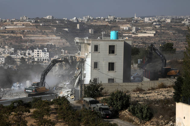 Israeli forces demolish a building in West Bank city of Hebron HEBRON, WEST BANK, PALESTINE - OCTOBER 23: Israeli military heavy machinery demolishes a building during a raid in the West Bank city of Hebron, Palestine, on October 23, 2026. The Israeli military announced earlier in the morning that two of its soldiers were killed during armed clashes with Palestinians, triggering a large-scale military operation and structural demolition in the city. Mamoun Wazwaz Anadolu Hebron West Bank. Editorial use only. Please get in touch for any other usage.  Copyright: x2026xAnadoluxMamounxWazwazx