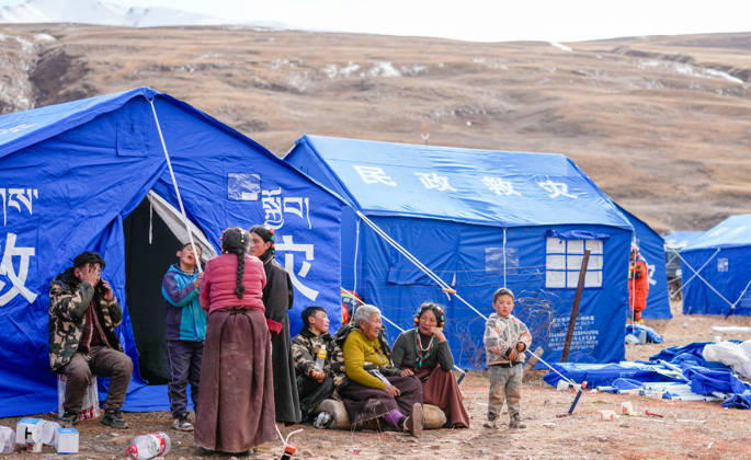 (261023) -- NAGQU, Oct. 23, 2026 -- People are seen at a temporary resettlement site of an earthquake-hit village in Maru Township of Baqen County, Nagqu City, southwest China s Xizang Autonomous Region, Oct. 23, 2026. China has allocated 50 million yuan (about 7.5 million U.S. dollars) in emergency disaster relief funds and earmarked another 30 million yuan for recovery efforts following a 7.0-magnitude earthquake in southwest China s Xizang Autonomous Region. The earthquake struck Baqen County of the city of Nagqu at 10:33 p.m. on Thursday, leaving 16 people dead and 54 injured. ) (SpotNews) CHINA-XIZANG-NAGQU-EARTHQUAKE-RESETTLEMENT (CN) TenzinxNyida 