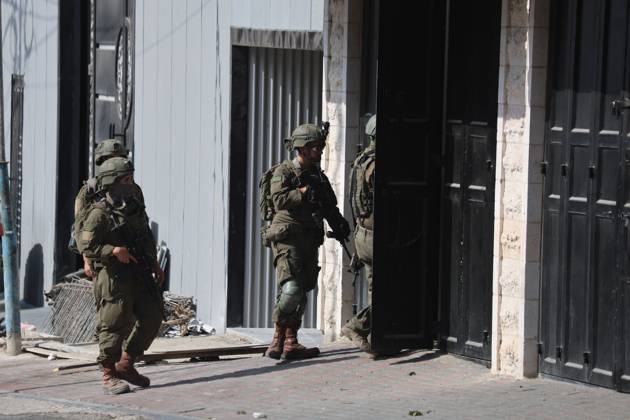 October 23, 2026, Hebron, Palestine, State of: HEBRON, PALESTINE, OCTOBER 23, 2026: Israeli forces raid homes belonging to the al-Jaaba family following a shooting attack at a military checkpoint at the entrance to Hebron in the occupied West Bank. The raids come as Israeli forces close entrances to the city and conduct searches following the attack earlier in the day. Hebron Palestine, State of - ZUMAq101 20261023_zna_q101_108 Copyright: xMosabxShawerx