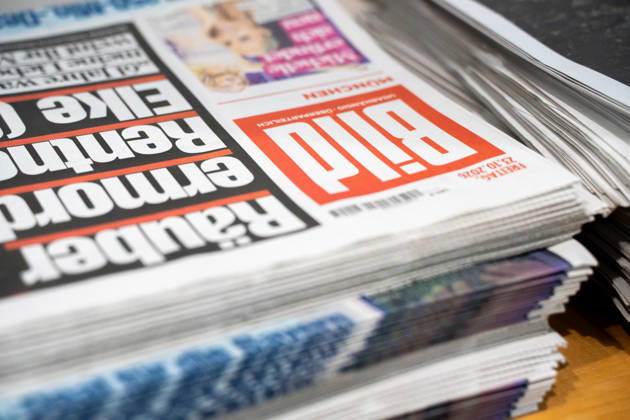 Munich, Bavaria, Germany October 23, 2026: The 2026 convention of the CSU (Christian Social Union) at the Munich Trade Fair Center. Background detail: a stack of newspapers, copies of the daily newspaper BILD published by Axel Springer Verlag