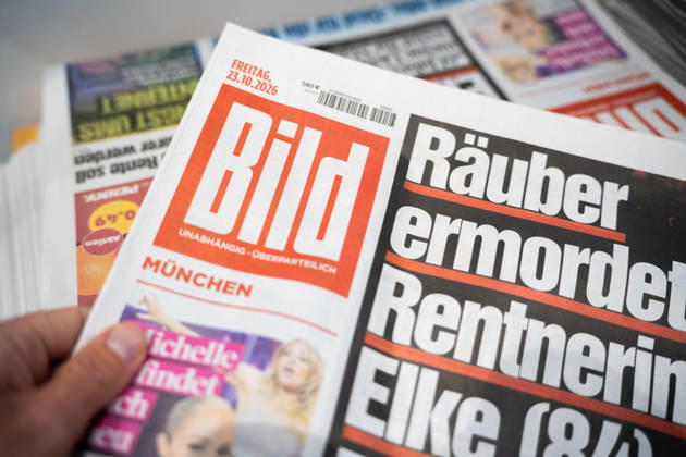 Munich, Bavaria, Germany October 23, 2026: The 2026 convention of the CSU (Christian Social Union) at the Munich Trade Fair Center. Background detail: a stack of newspapers, copies of the daily newspaper BILD published by Axel Springer Verlag