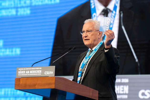 Munich, Bavaria, Germany October 23, 2026: The 2026 convention of the CSU (Christian Social Union) at the Munich Trade Fair Center. Joachim Herrmann (Bavarian Minister of the Interior) holds a voting card in his hand