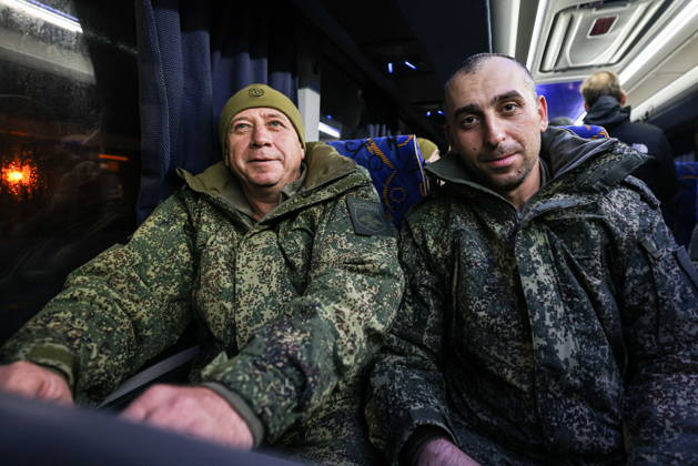RUSSIA, MOSCOW REGION - OCTOBER 23, 2026: Russian servicemen released from Ukrainian captivity are seen in a bus. Georgy Chernyshov TASS  99833314