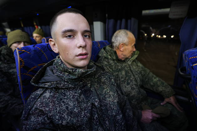 RUSSIA, MOSCOW REGION - OCTOBER 23, 2026: Russian servicemen released from Ukrainian captivity are seen in a bus. Georgy Chernyshov TASS  99833318