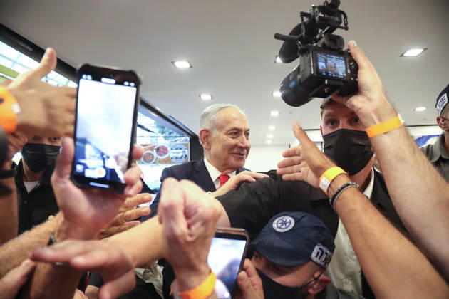 (261023) -- TEL AVIV, Oct. 23, 2026 -- Israeli Prime Minister and Likud party leader Benjamin Netanyahu visits the Hatikva Market in Tel Aviv as part of his election campaign, Oct. 22, 2026. The general elections for Israel s Knesset, the country s parliament, will be held on Oct. 27. ( via Xinhua) ISRAEL-TEL AVIV-ELECTIONS-CAMPAIGN GideonxMarkowicz JINI 