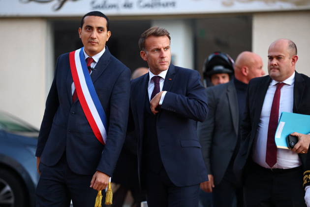 French President Macron in Trappes After Deadly Shooting - France French President Emmanuel Macron walks with Mayor of Trappes Ali Rabeh as he arrives for a meeting at the town hall after a drive-by shooting during which a person was killed and at least four others were wounded including a 12-year-old girl, in Trappes, in the Yvelines department, near Paris, France, October 23, 2026. Photo by Hannah McKay Pool ABACAPRESS.COM Trappes France  Copyright: xMcKayxHannah Pool ABACAx
