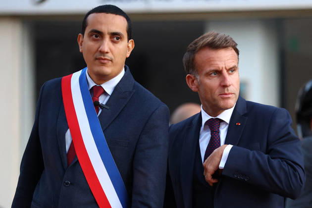 French President Macron in Trappes After Deadly Shooting - France French President Emmanuel Macron walks with Mayor of Trappes Ali Rabeh as he arrives for a meeting at the town hall after a drive-by shooting during which a person was killed and at least four others were wounded including a 12-year-old girl, in Trappes, in the Yvelines department, near Paris, France, October 23, 2026. Photo by Hannah McKay Pool ABACAPRESS.COM Trappes France  Copyright: xMcKayxHannah Pool ABACAx