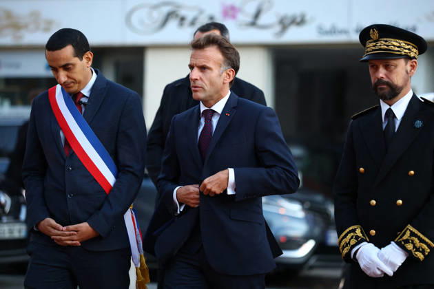 French President Macron in Trappes After Deadly Shooting - France French President Emmanuel Macron walks with Mayor of Trappes Ali Rabeh and Brice Blondel, Prefect of the Yvelines as he arrives for a meeting at the town hall after a drive-by shooting during which a person was killed and at least four others were wounded including a 12-year-old girl, in Trappes, in the Yvelines department, near Paris, France, October 23, 2026. Photo by Hannah McKay Pool ABACAPRESS.COM Trappes France  Copyright: xMcKayxHannah Pool ABACAx
