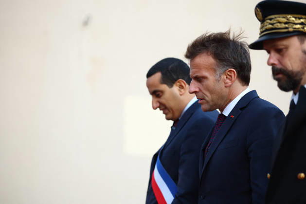 French President Macron in Trappes After Deadly Shooting - France French President Emmanuel Macron walks with Mayor of Trappes Ali Rabeh as he arrives for a meeting at the town hall after a drive-by shooting during which a person was killed and at least four others were wounded including a 12-year-old girl, in Trappes, in the Yvelines department, near Paris, France, October 23, 2026. Photo by Hannah McKay Pool ABACAPRESS.COM Trappes France  Copyright: xMcKayxHannah Pool ABACAx