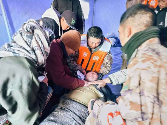 (261024) -- NAGQU, Oct. 24, 2026 -- Members of the People s Armed Police Force Xizang Corps provide medical treatment to a villager at a quake-hit village in Maru Township of Baqen County, Nagqu City, southwest China s Xizang Autonomous Region, Oct. 23, 2026. Sixteen people have been killed and 76 others are injured following a 7.0-magnitude earthquake that struck Baqen County of the city of Nagqu in southwest China s Xizang Autonomous Region at 10:33 p.m. on Thursday, local authorities said. (Photo by Xinhua) (SpotNews) CHINA-XIZANG-NAGQU-EARTHQUAKE-RESCUE (CN) WangxJianing 