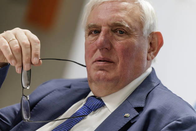 Karl Josef Laumann (CDU), Minister of Labor and Social Affairs for North Rhine-Westphalia, held the arm of his glasses in the corner of his mouth on October 23, 2026, during a WVS business breakfast at the Caritas Emstor Workshops (WfbM) in Rheine, North Rhine