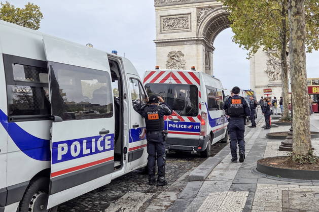 FRANCE, PARIS - OCTOBER 24, 2026: The police are seen near the Arc de Triomphe. Security measures have been tightened in the French capital as mass protests involving trade unions and university students are expected. Dmitry Orlov TASS  99860467