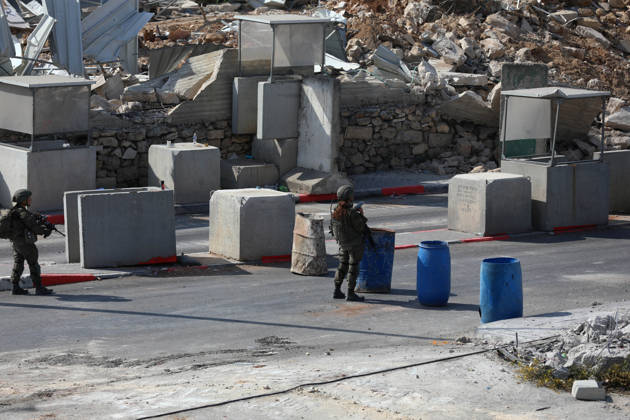 Palestinian homes in the ??Hebron destroyed following a clash at a checkpoint HEBRON, WEST BANK, PALESTINE - OCTOBER 24: Israeli forces take security measures at the Farsh Al Hawa military checkpoint, where Palestinian homes and structures have been demolished byby Israeli army heavy machinery in Hebron, West Bank, Palestine on Saturday, October 24, 2026. The demolitions followed a deadly shootout at the local checkpoint involving two Palestinians and two Israeli soldiers, leading to a total lockdown of Hebron and surrounding communities. Wisam Hashlamoun Anadolu Hebron West Bank. Editorial use only. Please get in touch for any other usage.  Copyright: x2026xAnadoluxWisamxHashlamounx