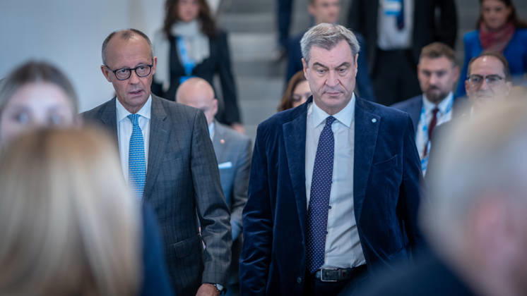 Chancellor Friedrich Merz speaks here alongside CSU Party Chairman Markus Söder on their way to Exhibition Hall C6 at the CSU Party Convention in Munich, Munich, Bavaria, Germany, Munich Exhibition Center