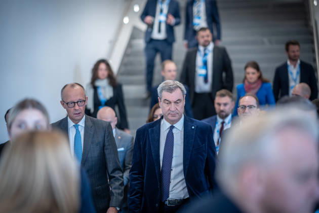 Chancellor Friedrich Merz speaks here alongside CSU Party Chairman Markus Söder on their way to Exhibition Hall C6 at the CSU Party Convention in Munich, Munich, Bavaria, Germany, Munich Exhibition Center