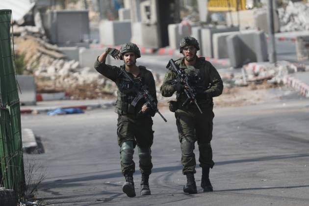 Israeli Soldiers and Military Vehicles Deployed Near Checkpoint in Hebron Israeli soldiers and military vehicles are deployed near a checkpoint where a shooting attack took place in the West Bank city of Hebron, on October 24, 2026. The deployment comes amid continuing Israeli military operations and heightened security measures in the area. Photo by Mamoun Wazwaz apaimages Hebron West Bank Palestinian Territory 241026_Hebron_MW_04(25) Copyright: xapaimagesxMamounxWazwazx xapaimagesx