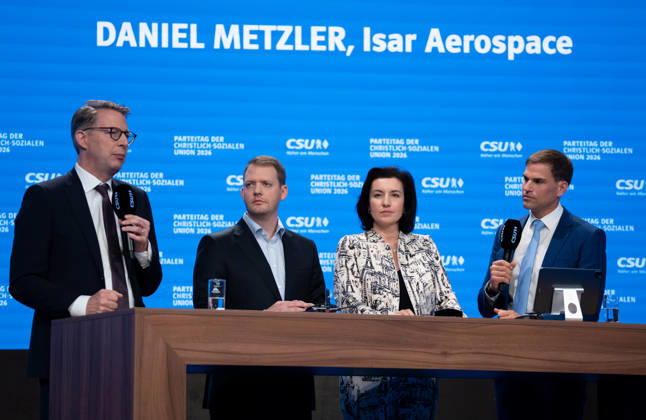 Munich, Bavaria, Germany October 24, 2026: Day 2 of the 2026 CSU (Christian Social Union) Party Convention at the Munich Trade Fair Center. Markus Blume (Member of the Bavarian State Parliament), Daniel Metzler (co-founder and CEO of the German space startup Isar Aerospace), Dorothee Bär (Member of the German Bundestag, Federal Minister for Research, Technology, and Space of the Federal Republic of Germany), and Maximilian Böltl (Member of the Bavarian State Parliament) on stage