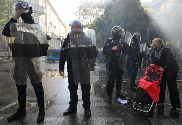 Mass Anti-Government National Protest in Tirana TIRANA, ALBANIA - OCTOBER 24: An elderly woman walks by a line of heavily armored riot police officers on October 24, 2026, in Tirana, Albania. Unrest and physical confrontations erupt in Tirana city center as demonstrators and riot police clash during a massive nationwide protest, turning the capital s main avenue into a major flashpoint as chaotic skirmishes broke out between security forces and factions of the crowd. Artur Widak Anadolu Tirana Albania. Editorial use only. Please get in touch for any other usage.  Copyright: x2026xAnadoluxArturxWidakx