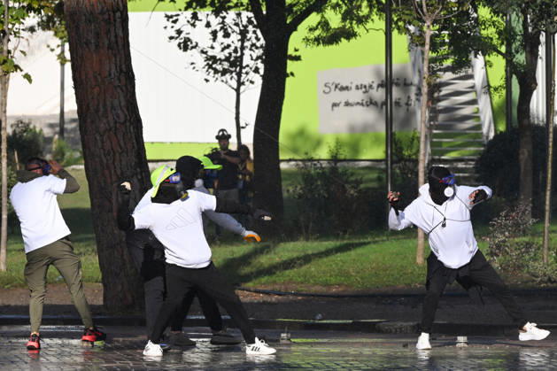 Mass Anti-Government National Protest in Tirana TIRANA, ALBANIA - OCTOBER 24: Masked demonstrators in matching white shirts throw stones and projectiles during street confrontations on October 24, 2026, in Tirana, Albania. Unrest and physical confrontations erupt in Tirana city center as demonstrators and riot police clash during a massive nationwide protest, turning the capital s main avenue into a major flashpoint as chaotic skirmishes broke out between security forces and factions of the crowd. Artur Widak Anadolu Tirana Albania. Editorial use only. Please get in touch for any other usage.  Copyright: x2026xAnadoluxArturxWidakx