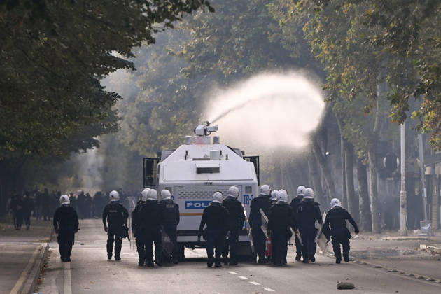 Mass Anti-Government National Protest in Tirana TIRANA, ALBANIA - OCTOBER 24: Riot police officers form a dense shield wall next to an active water cannon vehicle operating on a debris-strewn street on October 24, 2026, in Tirana, Albania. Unrest and physical confrontations erupt in Tirana city center as demonstrators and riot police clash during a massive nationwide protest, turning the capital s main avenue into a major flashpoint as chaotic skirmishes broke out between security forces and factions of the crowd. Artur Widak Anadolu Tirana Albania. Editorial use only. Please get in touch for any other usage.  Copyright: x2026xAnadoluxArturxWidakx