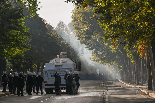 Mass Anti-Government National Protest in Tirana TIRANA, ALBANIA - OCTOBER 24: Riot police officers form a dense shield wall next to an active water cannon vehicle operating on a debris-strewn street on October 24, 2026, in Tirana, Albania. Unrest and physical confrontations erupt in Tirana city center as demonstrators and riot police clash during a massive nationwide protest, turning the capital s main avenue into a major flashpoint as chaotic skirmishes broke out between security forces and factions of the crowd. Artur Widak Anadolu Tirana Albania. Editorial use only. Please get in touch for any other usage.  Copyright: x2026xAnadoluxArturxWidakx