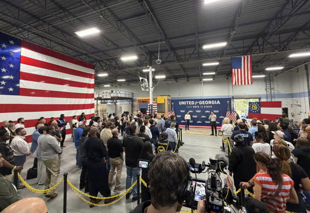 October 24, 2026, Atlanta, Georgia, USA: Jon Ossoff and Pete Buttigieg Knock Doors in Atlanta, Georgia. November 24, 2026 Atlanta USA  - ZUMAs380 20261024_zep_s380_050 Copyright: xDerekxStormx