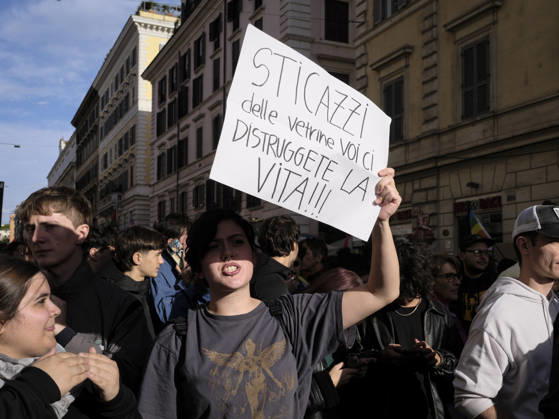 Rome Anti War Protest A demonstrator holds a sign reading Who cares about shop windows, you re destroying our lives! during an anti-war protest in Rome, Italy on October 24, 2026. Demonstrators took part in an anti-war march under the slogan Keep Italy Out of the War . Protesters further voiced opposition to Italy s involvement in armed conflicts, military rearmament and government policies. Rome Lazio Italy Copyright: xAndreaxCalandrax