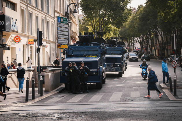 Marseille France Street Protests Police officers stand beside military vehicles on a street in Marseille, France on October 24, 2026. Authorities deployed around 70,000 security personnel across France for renewed protests over the cost of living, after unrest a week earlier saw public buildings damaged, hundreds of shops looted and about 2,700 people arrested. Marseille Provence-Alpes-CÃ te France Copyright: xNaelxChahinex