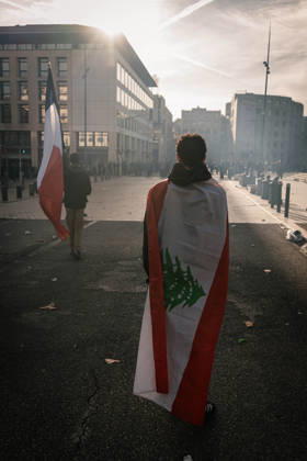 Marseille France Street Protests A demonstrator draped in a Lebanese flag walks along a street during a protest in Marseille, France on October 24, 2026. Authorities deployed around 70,000 security personnel across France for renewed protests over the cost of living, after unrest a week earlier saw public buildings damaged, hundreds of shops looted and about 2,700 people arrested. Marseille Provence-Alpes-CÃ te France Copyright: xNaelxChahinex