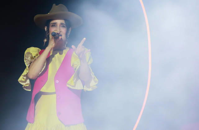 October 24, 2026, Tijuana, Baja California, Mexico: Mexican singer-songwriter JULIETA VENEGAS sings into a microphone while gesturing on stage during the Tecate Peninsula 2026 music festival at Explanada Estadio Caliente in Tijuana, Baja California, Mexico, October 24, 2026. She wears a brown hat, a yellow dress, and a pink vest. Tijuana Mexico - ZUMAm311 20261024_zip_m311_011 Copyright: xAlbertoxMartinezx