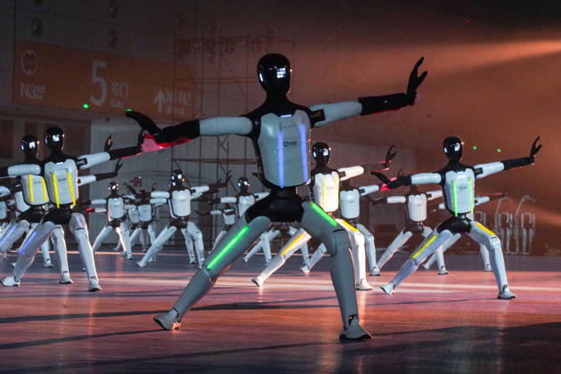 JINAN, CHINA - OCTOBER 24: One hundred and ten domestic humanoid robots perform a synchronized dance to challenge for the Guinness World Record for most humanoid robots dancing simultaneously at Jinan Yellow River International Convention and Exhibition Center on October 24, 2026 in Jinan, Shandong Province of China.  Copyright: xVCGx 111676793333