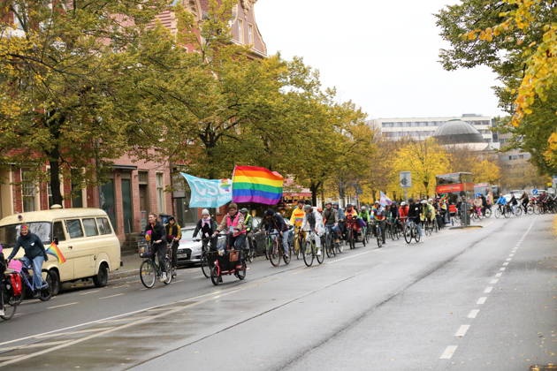Protesters ride with a rainbow flag on Charlottenstraße during Bike Pride in Potsdam, October 24, 2026 Bike Pride Potsdam