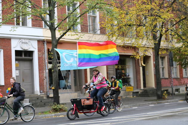 Protesters ride with a rainbow flag on Charlottenstraße during Bike Pride in Potsdam, October 24, 2026 Bike Pride Potsdam