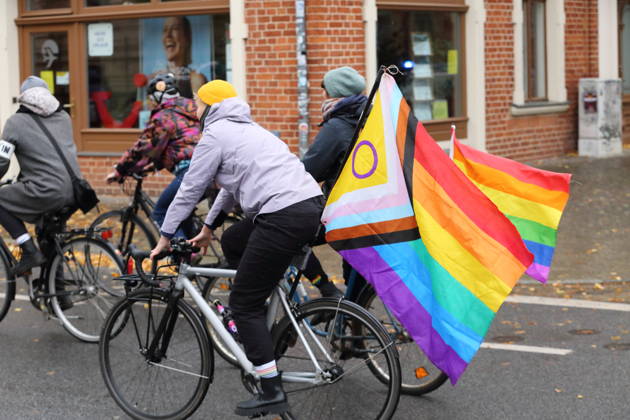 Protesters ride down Kurfürstenstraße waving rainbow flags during Bike Pride in Potsdam, October 24, 2026 Bike Pride Potsdam
