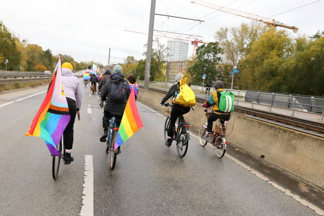 Protesters ride with a rainbow flag down Nuthestraße heading out of town during Bike Pride in Potsdam, October 24, 2026 Bike Pride Potsdam