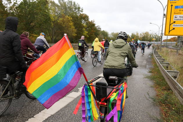 Protesters ride with a rainbow flag down Nuthestraße heading out of town during Bike Pride in Potsdam, October 24, 2026 Bike Pride Potsdam