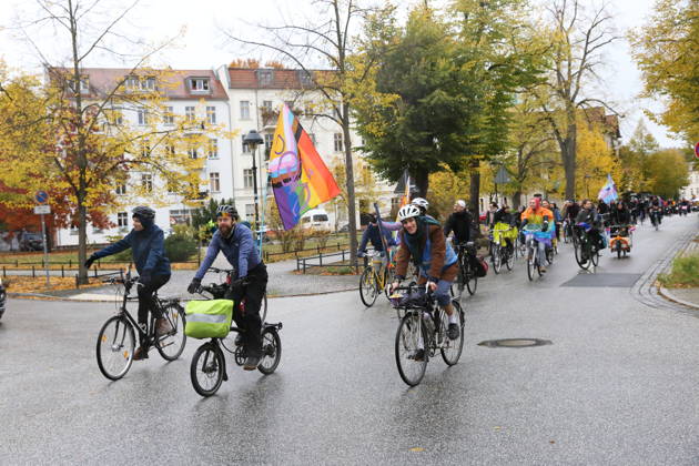 Protesters ride with a rainbow flag at Plantagenplatz in Babelsberg during Bike Pride in Potsdam, October 24, 2026 Bike Pride Potsdam