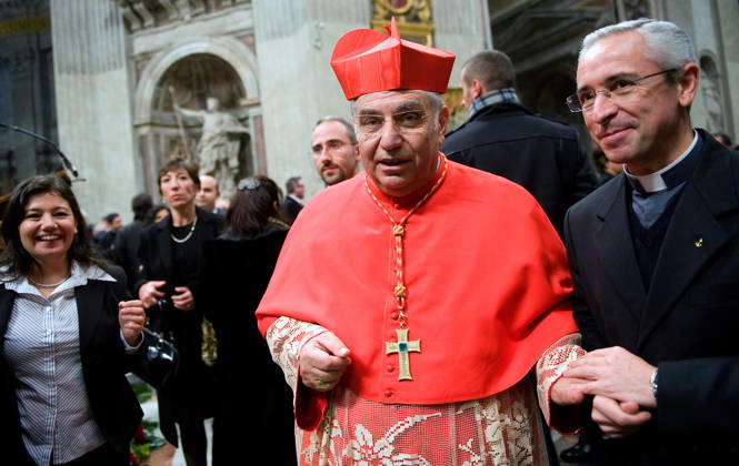 IPA90156508 - New Cardinal Paolo Romeo of Palermo, Italy (L) is congratulated by pilgrims after receiving the red biretta—a four-cornered red hat—from Pope Benedict XVI during the consistory ceremony in St. Peter s Basilica at the Vatican on November 20, 2010  Copyright: xx xALESSIAxGIULIANI CPPx IPA90156508