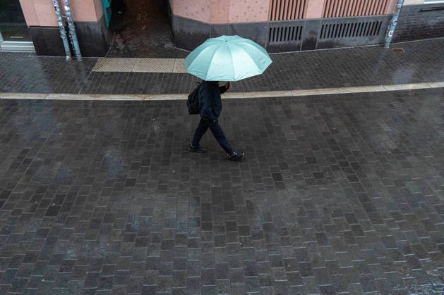 October 25, 2026, Frankfurt, Hesse, Germany: A person walks with an umbrella in the rain in Frankfurt am Main, Germany. Frankfurt Germany - ZUMAb332 20261025_zip_b332_003 Copyright: xMatiasxBasualdox