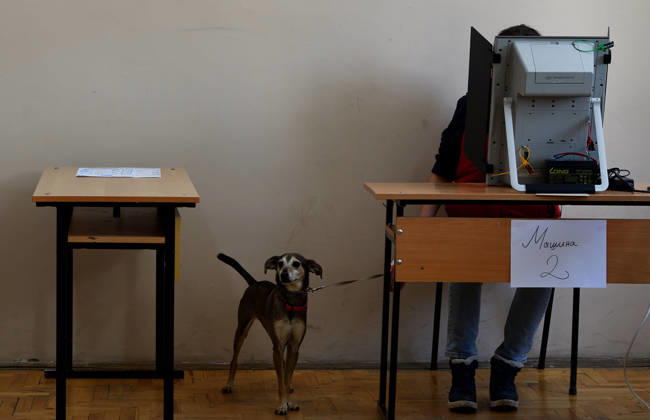 President Elections in Bulgaria A woman casts her vote at a polling station during the first round of the presidential election in Sofia, Bulgaria, October 25, 2026. Nearly 6.6 million eligible voters are set to elect the seventh president of Bulgaria in the first round of voting. Sofia Bulgaria  Copyright: xMatrixxImagesx xVassilxDonevx