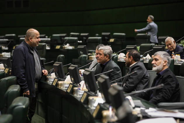 October 25, 2026, Tehran, Iran: Several male lawmakers gather around their desks while one stands speaking to colleagues seated beside him at the Islamic Consultative Assembly in Tehran, Iran, on October 25, 2026. The Iranian parliament held a hybrid open sitting, with some lawmakers attending in the Tehran chamber and others participating remotely, according to parliamentary reports. Tehran Iran - ZUMAi98_ 20261025_zih_i98_081 Copyright: xIcanax