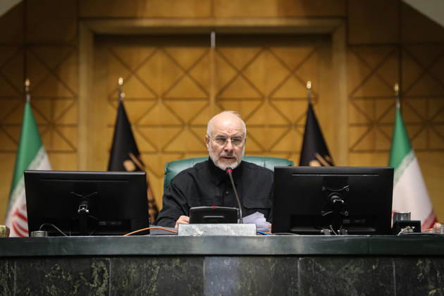 October 25, 2026, Tehran, Iran: Mohammad Bagher Ghalibaf reads from a page at his desk between Iranian and parliamentary flags at the Islamic Consultative Assembly in Tehran, Iran, on October 25, 2026. The Islamic Consultative Assembly resumed an open sitting in its Tehran chamber with a mix of in-person and remote participation, according to parliamentary reporting. Tehran Iran - ZUMAi98_ 20261025_zih_i98_091 Copyright: xIcanax