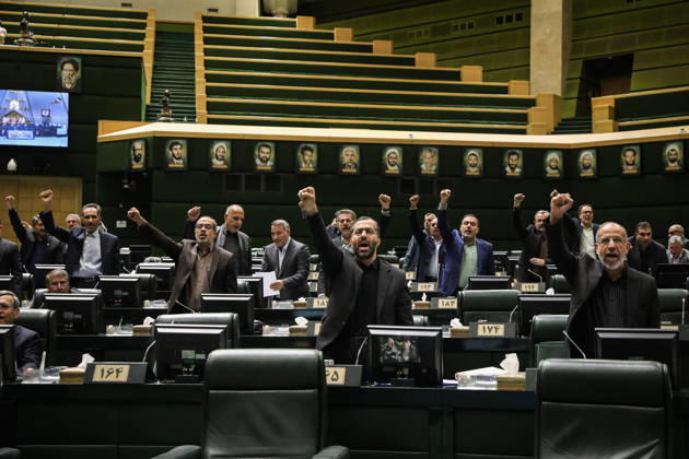 October 25, 2026, Tehran, Iran: Members of parliament raise their fists or hands from the chamber floor during the open session at the Islamic Consultative Assembly in Tehran, Iran, on October 25, 2026. Speaker Mohammad Bagher Ghalibaf chaired the October 25 session, which combined physical attendance at the Islamic Consultative Assembly with participation by video link. Tehran Iran - ZUMAi98_ 20261025_zih_i98_100 Copyright: xIcanax