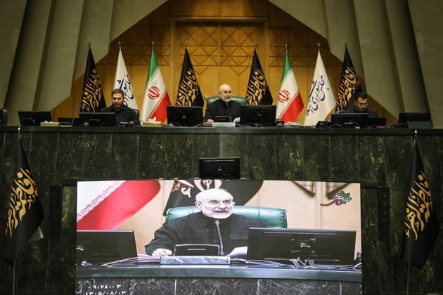 October 25, 2026, Tehran, Iran: Mohammad Bagher Ghalibaf presides beneath Iranian and parliamentary flags while his image appears on a large display below the desk at the Islamic Consultative Assembly in Tehran, Iran, on October 25, 2026. The Islamic Consultative Assembly resumed an open sitting in its Tehran chamber with a mix of in-person and remote participation, according to parliamentary reporting. Tehran Iran - ZUMAi98_ 20261025_zih_i98_105 Copyright: xIcanax