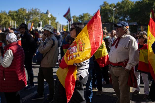 October 25, 2026, Madrid, Spain: A woman waves a Spanish flag..Thousands of people in Madrid have rallied in support of the demands made by women from Ceuta known locally as caballas who are calling for a return to normalcy in the autonomous city. Madrid Spain - ZUMAs197 20261025_aaa_s197_120 Copyright: xDavidxCanalesx