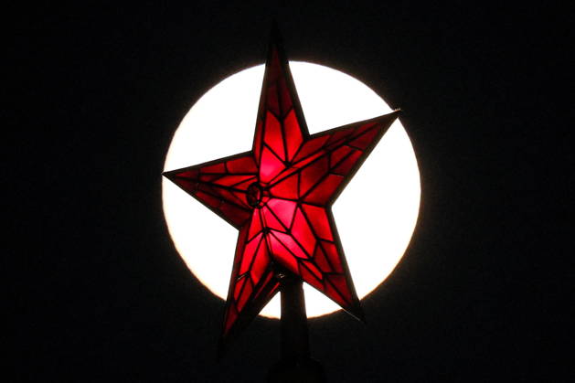 RUSSIA, MOSCOW - OCTOBER 25, 2026: A red star atop a tower of the Moscow Kremlin is silhouetted against the full moon shining over the city. Sergei Savostyanov TASS  99996162