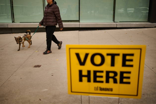 October 26, 2026, Toronto, On, Canada: People pass election signage as they head to the polls to vote in Toronto s municipal election, on Monday, Oct. 26, 2026. Toronto Canada  - ZUMAc35_ 20261026_zaf_c35_047 Copyright: xSammyxKoganx